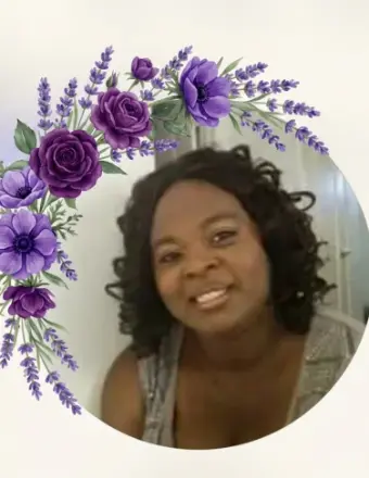 Smiling woman framed by purple floral border