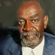 Portrait of older man in suit and tie