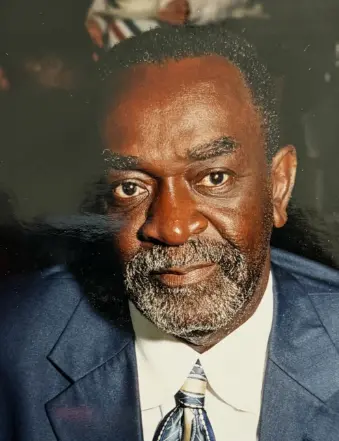 Portrait of older man in suit and tie