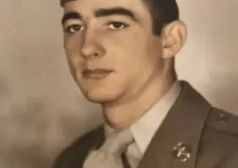 Vintage portrait of young soldier in uniform