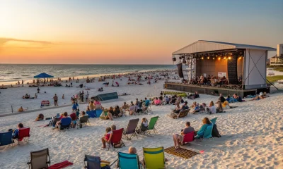 Beachfront concert at sunset with seated audience