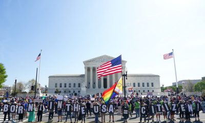 Protesters outside Supreme Court with American flags