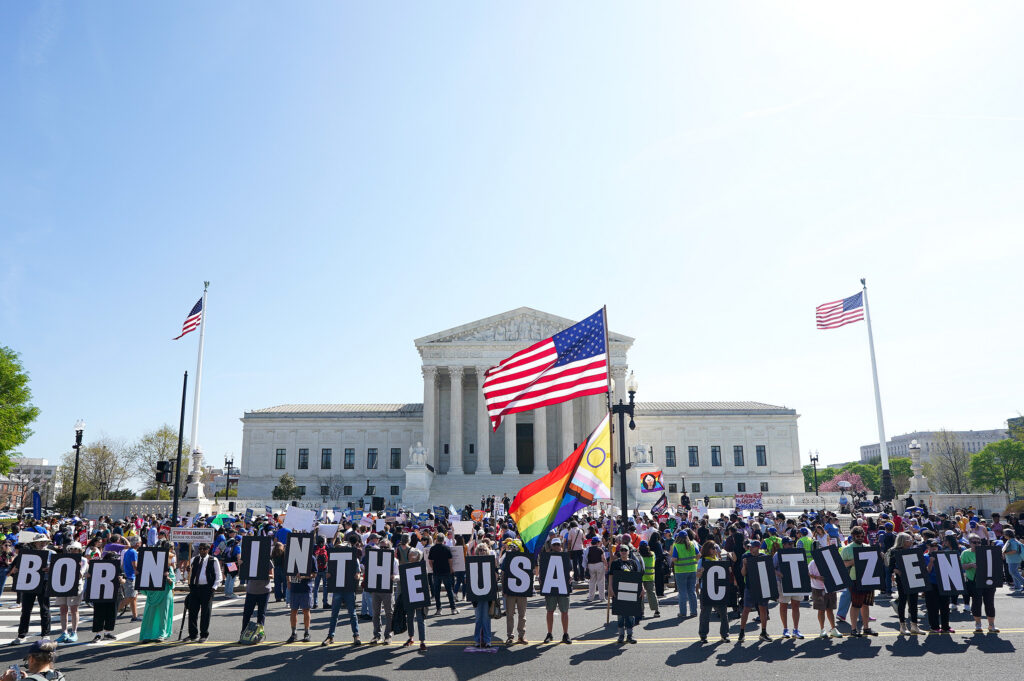 Protesters outside Supreme Court with American flags