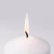 Close-up of white candle with flame