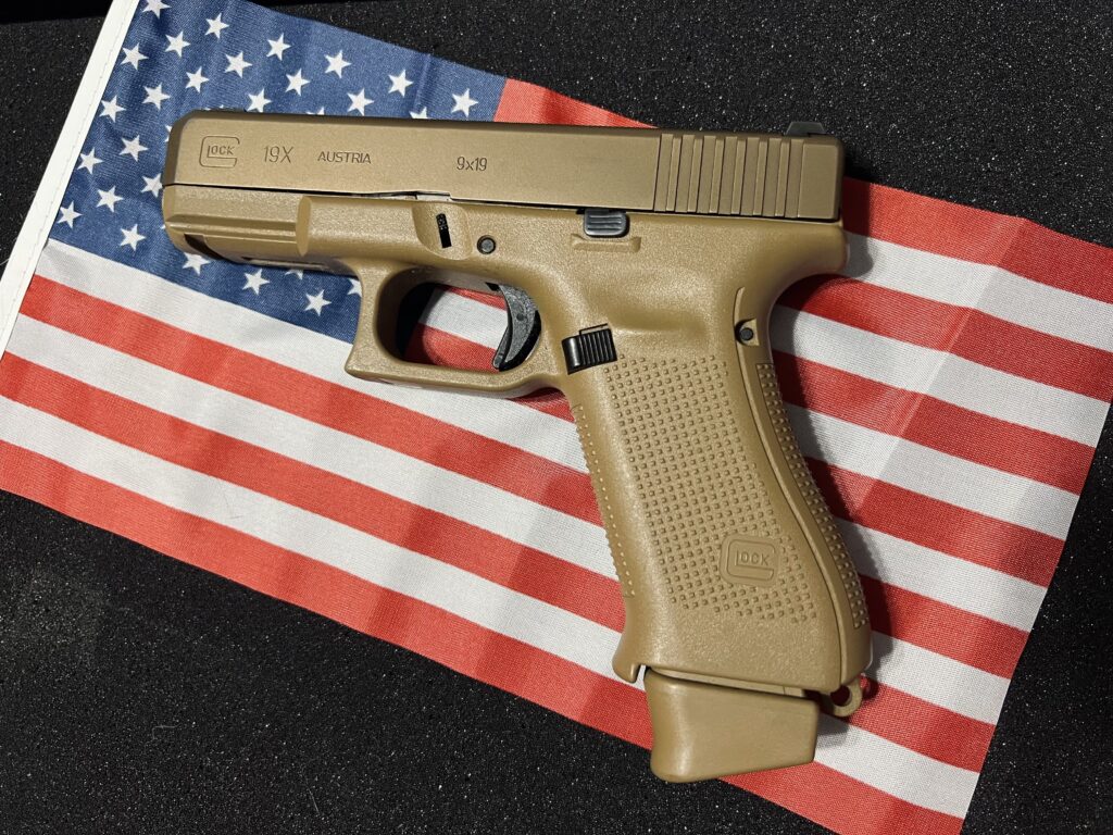 Glock 19X handgun on American flag