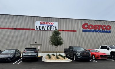 Costco Wholesale store exterior with Now Open banner