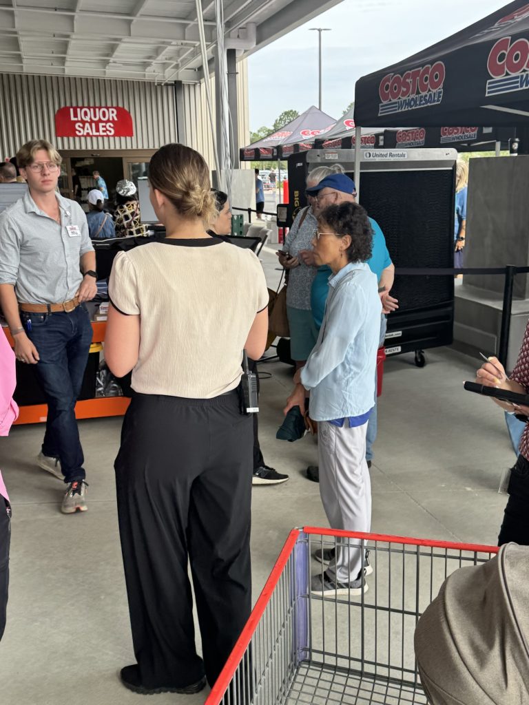 Shoppers gathered near Costco liquor sales entrance