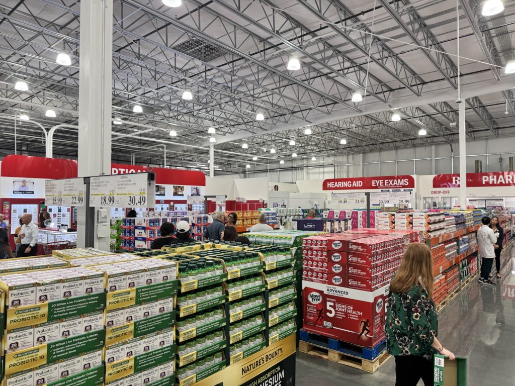 Costco Warehouse store interior with supplements and shoppers
