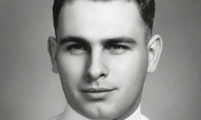 Black-and-white portrait of young man in military uniform