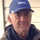 Elderly man wearing blue baseball cap outdoors
