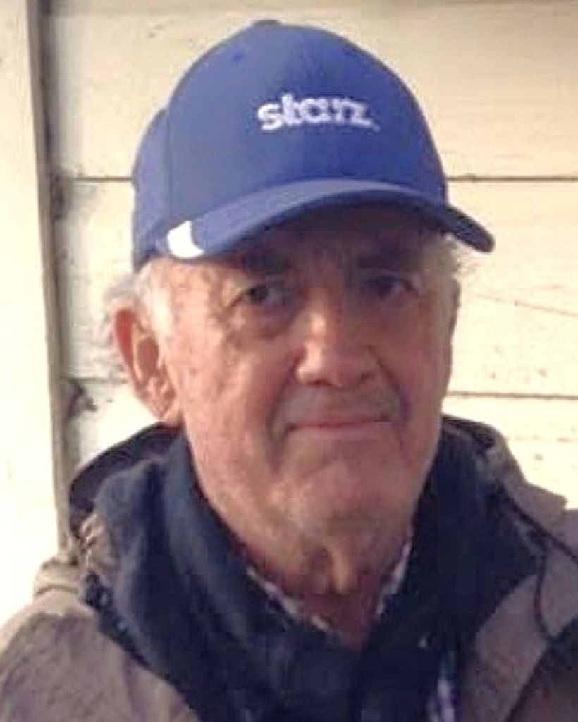 Elderly man wearing blue baseball cap outdoors