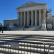 U.S. Supreme Court building with closed area sign
