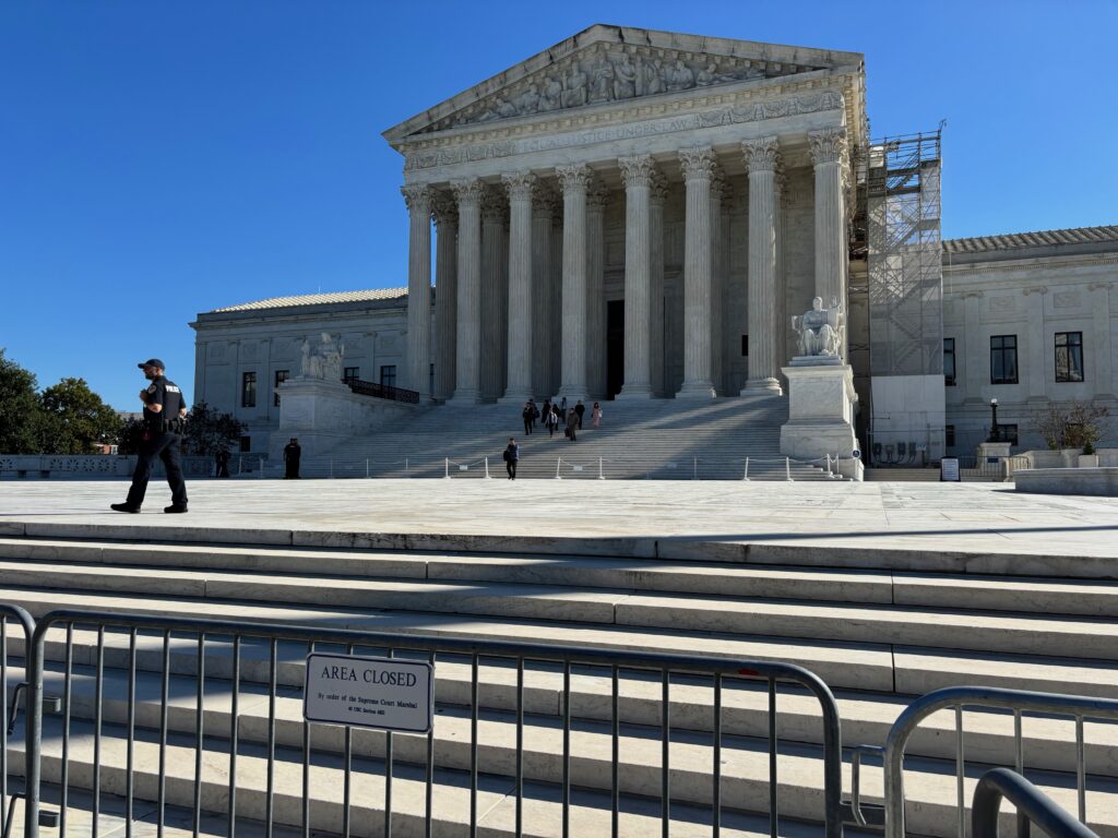 U.S. Supreme Court building with closed area sign