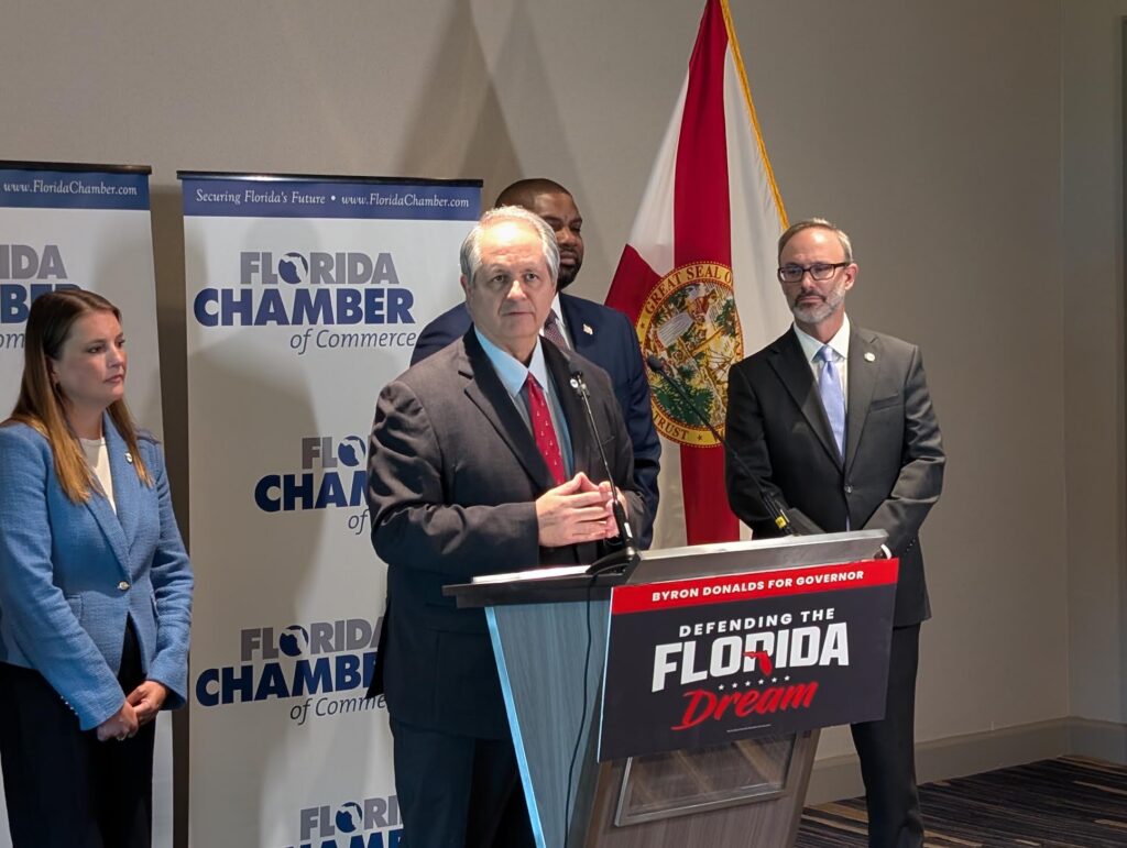 Man speaking at Florida campaign press conference