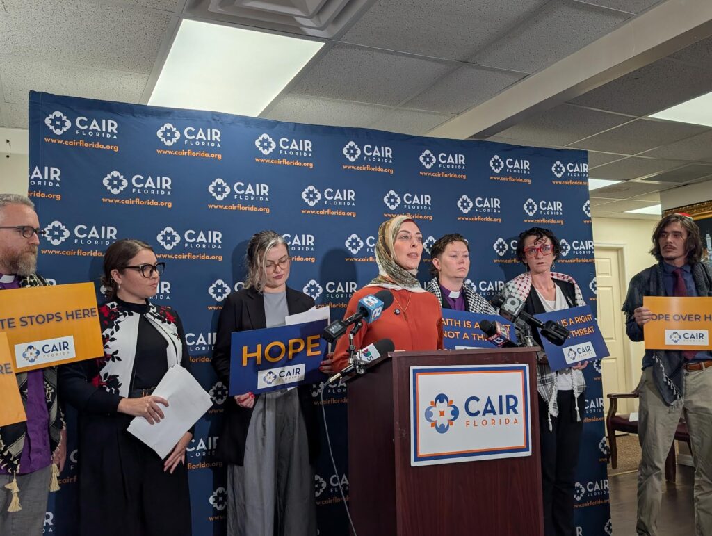 CAIR Florida press conference with speakers and signs