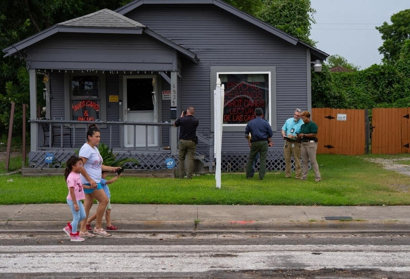 Police outside small psychic shop in neighborhood