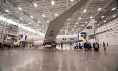 U.S. Navy aircraft inside large maintenance hangar