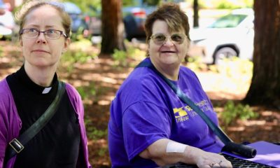 Two women sitting at outdoor picnic table
