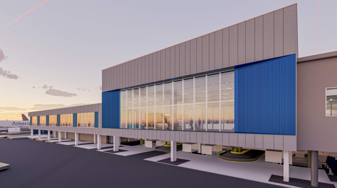 Modern airport terminal with jet bridges at sunset