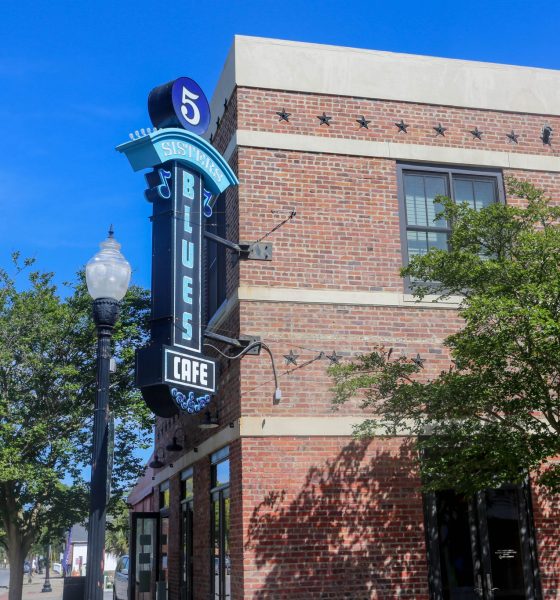 5 Sisters Blues Cafe sign on brick building