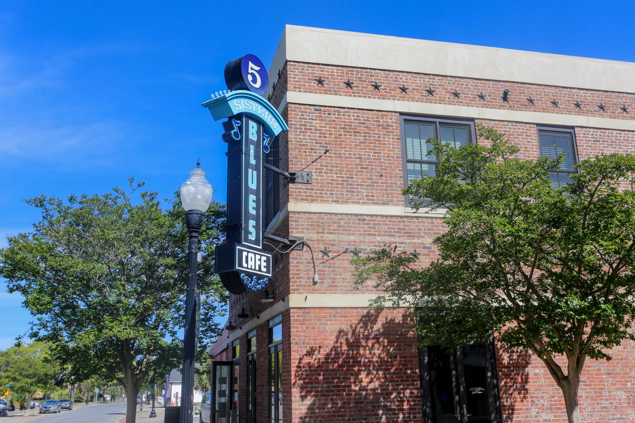 5 Sisters Blues Cafe sign on brick building