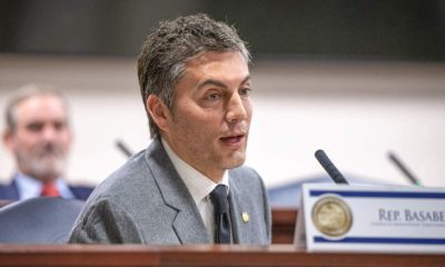 Man speaking at legislative hearing microphone