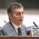 Man speaking at legislative hearing microphone