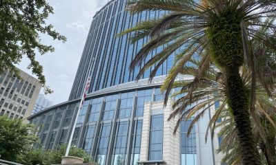 Modern United States courthouse with palm tree