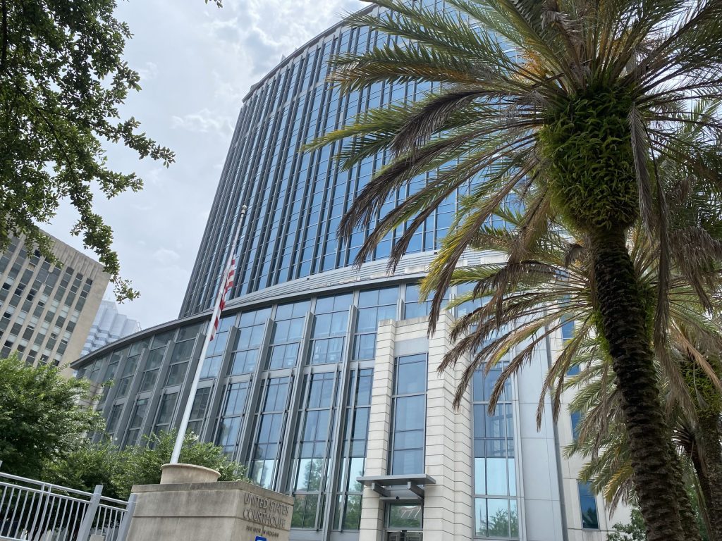 Modern United States courthouse with palm tree
