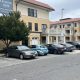 Apartment building with parking lot and leasing sign