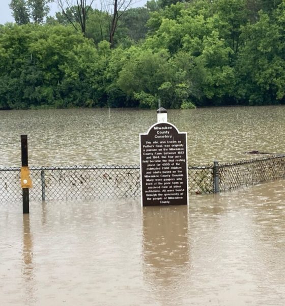 Flooded Milwaukee County Cemetery sign and fence — Northwest Florida FEMA disaster aid