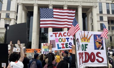 Protesters with signs outside Duval County Courthouse