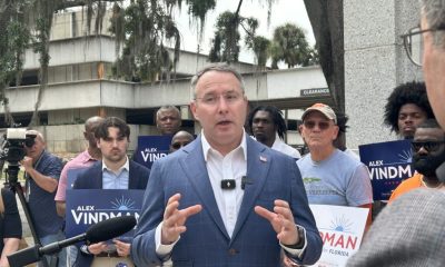 Man speaking at outdoor campaign press conference