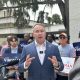 Man speaking at outdoor campaign press conference