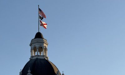 Domed building with U.S. and Florida flags