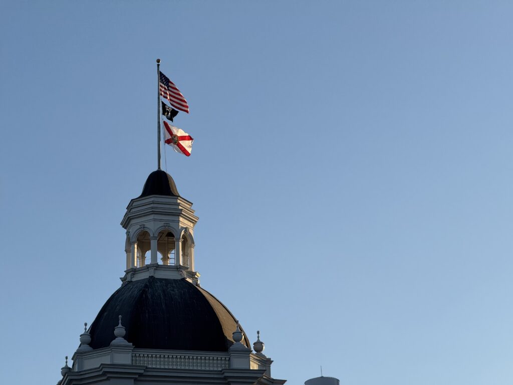 Domed building with U.S. and Florida flags