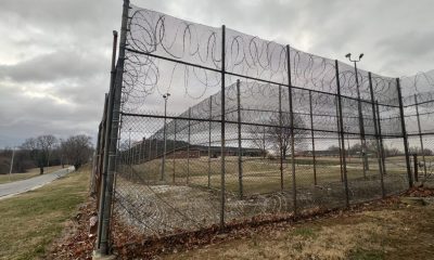 Barbed wire fence surrounding prison yard