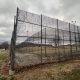 Barbed wire fence surrounding prison yard
