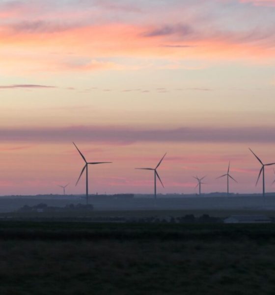 Wind turbines at sunset over rural landscape