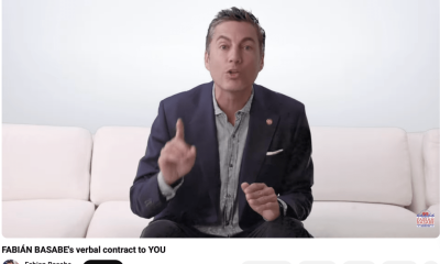 Man speaking on couch in YouTube video