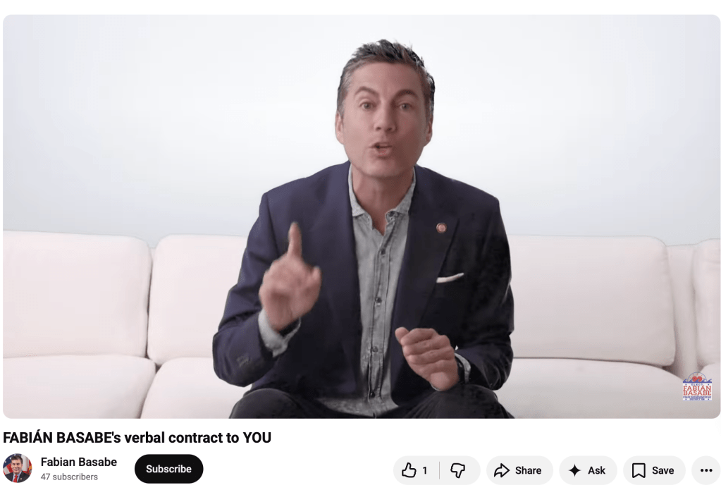 Man speaking on couch in YouTube video