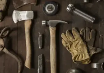 Vintage woodworking tools arranged on wooden table