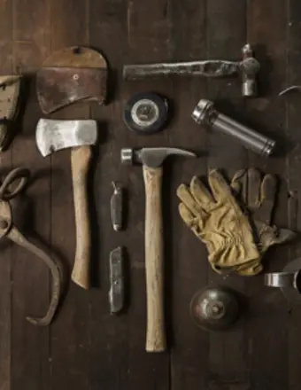 Vintage woodworking tools arranged on wooden table