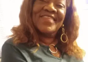 Smiling woman with long hair indoors