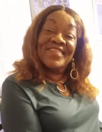 Smiling woman with long hair indoors