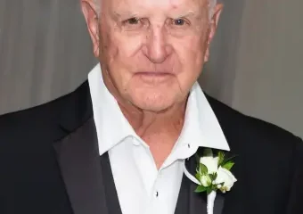 Elderly man in tuxedo with boutonniere