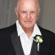 Elderly man in tuxedo with boutonniere