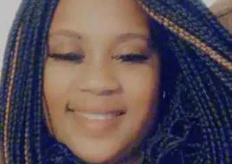 Smiling woman with long braided hair