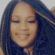 Smiling woman with long braided hair