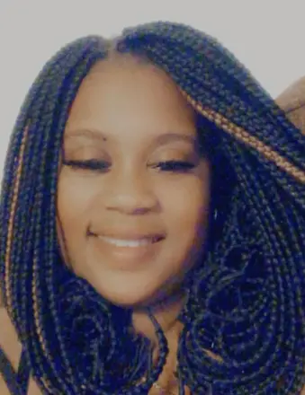 Smiling woman with long braided hair